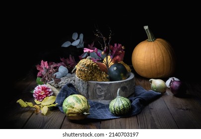 Pumpkin selection in dark rustic background - Shutterstock ID 2140703197