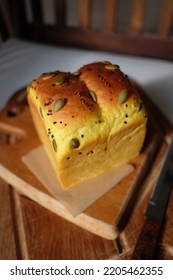 Pumpkin Shokupan Loaf Bread On A Wooden Board