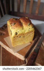 Pumpkin Shokupan Loaf Bread On A Wooden Board