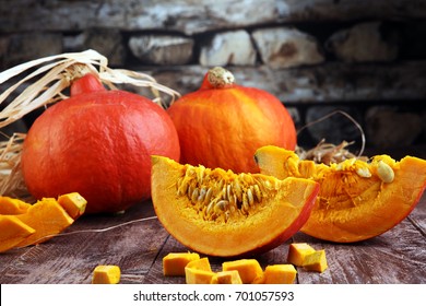 Pumpkin and pumpkin slices Autumn Healthy Food Nutrition Seasonal Vegetable Concept - Shutterstock ID 701057593