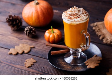 Pumpkin Smoothie, Spice Latte. Boozy Cocktail With Whipped Cream. Wooden Background.