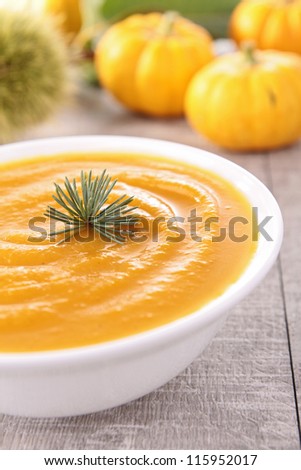 Similar – Image, Stock Photo Pumpkin and carrot soup on wooden table. Autumn food.