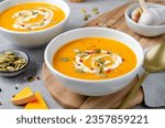 Pumpkin Soup, Tasty Homemade Pumpkin, Sweet Potato or Carrot Soup in a Bowl on Bright Background