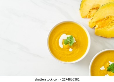 pumpkin soup in white bowl - Vegetarian and vegan food style - Shutterstock ID 2174865381
