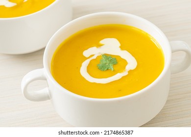 pumpkin soup in white bowl - Vegetarian and vegan food style - Shutterstock ID 2174865387