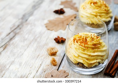 Pumpkin Spice Cheesecake Mousse On A White Wood Background. Toning. Selective Focus