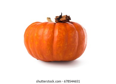 Pumpkin Spice Latte Concept. Large Pumpkin And Cinnamon Sticks Isolated Over White