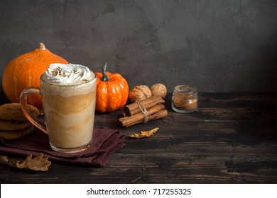 Pumpkin Spice Latte. Cup Of Latte With Seasonal Autumn Spices, Cookies And Fall Decor. Traditional Coffee Drink For Autumn Holidays.