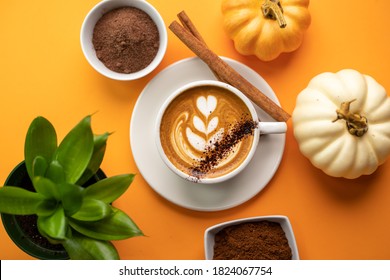 Pumpkin Spice Latte On A Orange Background With Copy Space With Latte Art In The Coffee