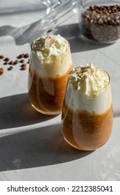 Pumpkin Spice Latte With Whipped Cream On A Table. Two Glasses Of Hot Autumn Drink