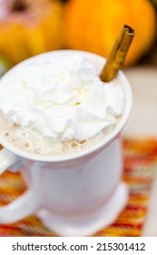 Pumpkin Spice Latter With Whipped Cream And Cinnamon Stick And