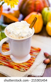 Pumpkin Spice Latter With Whipped Cream And Cinnamon Stick And