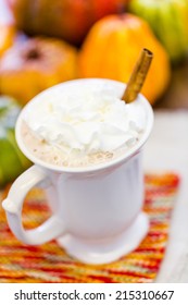 Pumpkin Spice Latter With Whipped Cream And Cinnamon Stick And