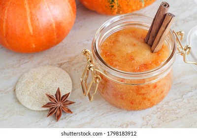 Pumpkin spice scrub with sugar, star anise and cinnamon in a glass jar. Homemade beauty treatment and spa recipe. Copy space. 
