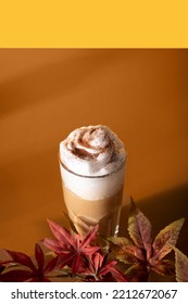 Pumpkin Spice Whipped Latte In Glasses. Hot Autumn Drink Beverage On Browm Background.