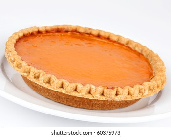 Pumpkin And Sweet Potato Pie On White Background