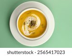 Pumpkin traditional soup with creamy silky texture garnished with pumpkin seeds Pumpkin soup is a usually 