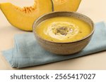 Pumpkin traditional soup with creamy silky texture garnished with pumpkin seeds Pumpkin soup is a usually 