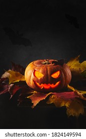 pumpkin-lantern Jack on Halloween in autumn leaves