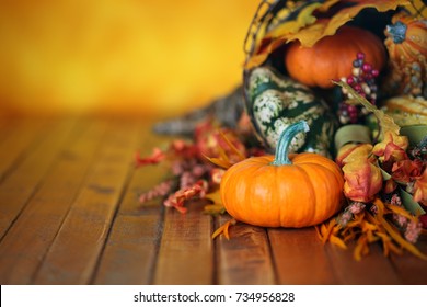 Pumpkins, Gourds, And Leaves In An Autumn Cornucopia Background