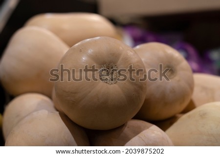 Pumpkins inside a box, in the background, in a market. Vegan concept.