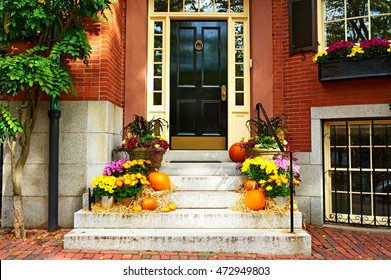 Pumpkins near the door during Halloween season