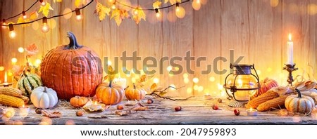 Pumpkins On Wooden Table - Thanksgiving Background With Vegetables And Bokeh Lights