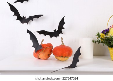 Pumpkins With Paper Bats Isolated On White