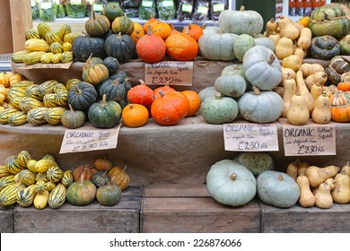 Pumpkins and squashes for sale at farmers market
