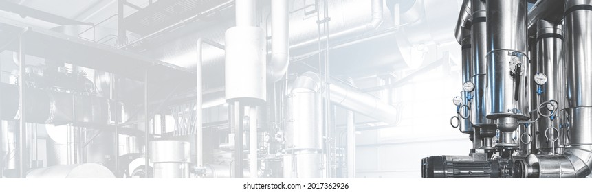 Pumps And Pipe Lines For Supplying Steam And Pressure Gauges In Modern Industrial Boiler Room. Panoramic Banner With Copy Space. Blue Toning