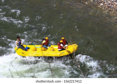 Punakha, Bhutan - April 09, 2017: Rafting In The Mo Chuu River By The Massive Punakha Dzong, A Buddhist Monastery And Fortress By The Mo Chhu River. 