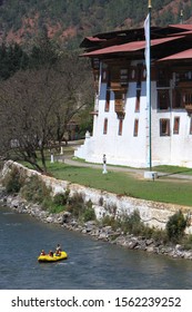 Punakha, Bhutan - April 09, 2017: Rafting In The Mo Chuu River By The Massive Punakha Dzong, A Buddhist Monastery And Fortress By The Mo Chhu River. 