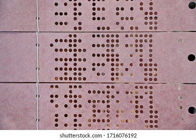 Punch card for controlling programmable industrial weaving loom, an early example of automation. Chains of punchcards used to store patterns