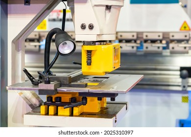 punch die or shear set on table semi automatic hydraulic press machine for forming cutting shearing notching punching or hole making of metal sheet in manufacturing process in industrial - Shutterstock ID 2025310397