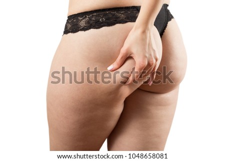 punch oversized female buttocks with cellulite on white background isolated