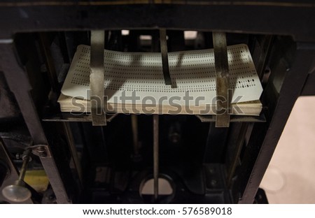 The punched card of an old device.