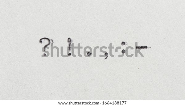 punctuation marks from typewriter. Vintage font on white\
paper 
