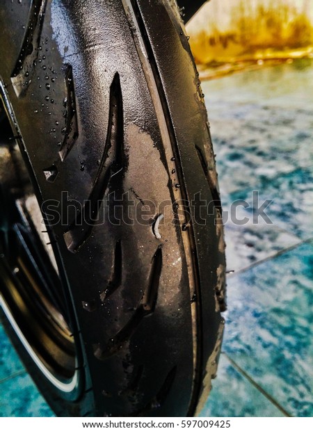 punctured motorcycle\
tire because of iron\
wire