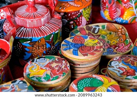 Pune, India, Handicraft items with selective focus, textile and wooden goods with traditional design for sale at Indian Market.