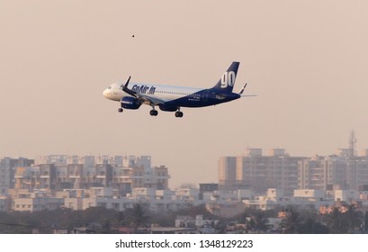 Pune, India - March 03 2019 Go Air Plane Flying With A Bird