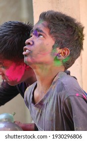 PUNE, INDIA- March 20, 2018, Kids Playing HOLI Indian Color Festival. Throwing Water Balloons 