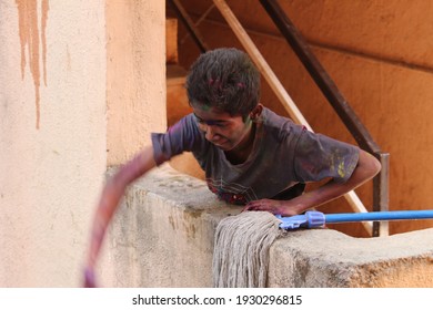 PUNE, INDIA- March 20, 2018, Kids Playing HOLI Indian Color Festival. Throwing Water Balloons 