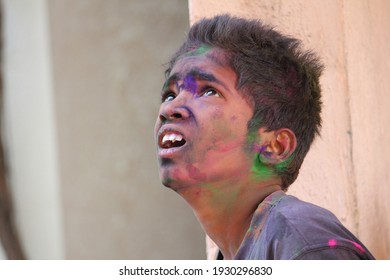 PUNE, INDIA- March 20, 2018, Kids Playing HOLI Indian Color Festival. Throwing Water Balloons 