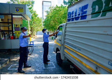 Pune, India - May 27 2020: Security Personnel Checking Temperature Of Visitors At A Office Building On Day 64 Of The Covid19 Related Lockdown At Pune India.