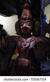 PUNE, INDIA - OCT 2, 2017 - Wooden Warrior Spirit Guarding Doorway, Raja Dinkar Kelkar Museum, Pune, India