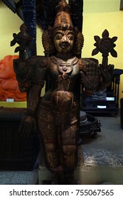 PUNE, INDIA - OCT 2, 2017 - Wooden Warrior Spirit Guarding Doorway, Raja Dinkar Kelkar Museum, Pune, India