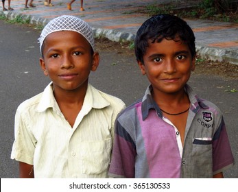 Pune, India - October 7, 2013: A Metaphorical Image Of A Small Indian Hindu And Muslim Boy Together Showing Communal Harmony Among Two Religions.  