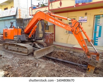 Pune, MH/INDIA- Jan 03, 2020: An Excavator Is Working In Residential Area For Paving Out Sewer Line.