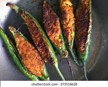 Pungent green stuffed chili. Indian homemade recipe. - Shutterstock ID 373518628