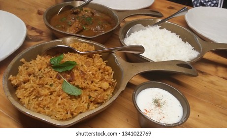 Punjabi Cuisine - Plan Rice, Ghee Rice, Chicken Amritsari And Dahi.